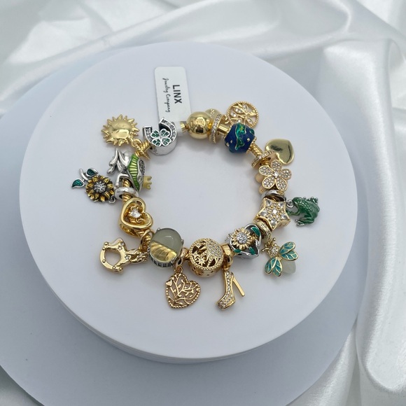 Linx Yellow Gold Bracelet with Gold and Green Themed Charms